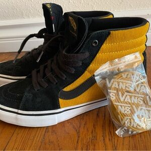 Vans Black and Gold High-Top Sneakers